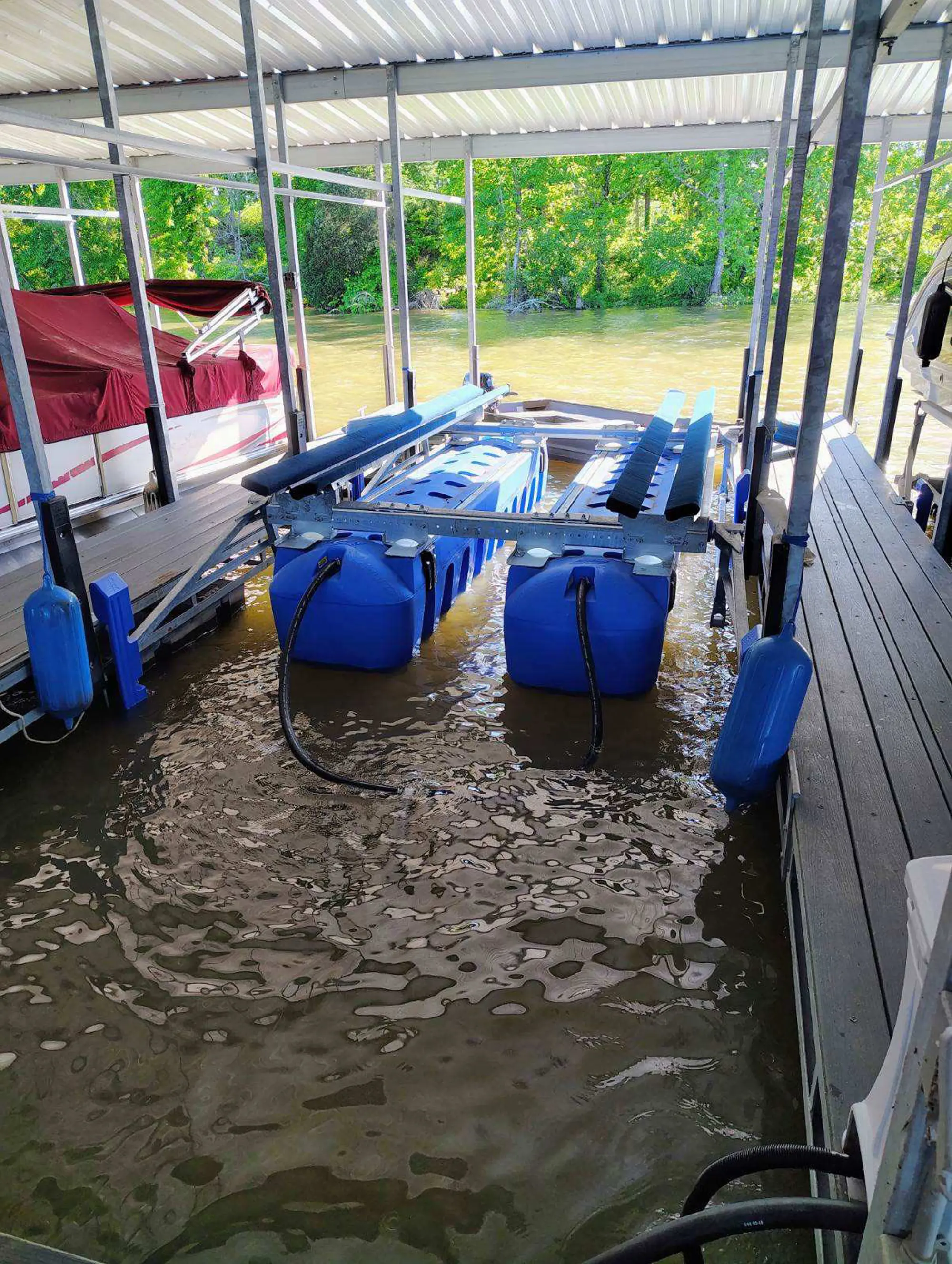 UltraLift boat lift installed in a covered freshwater boat slip