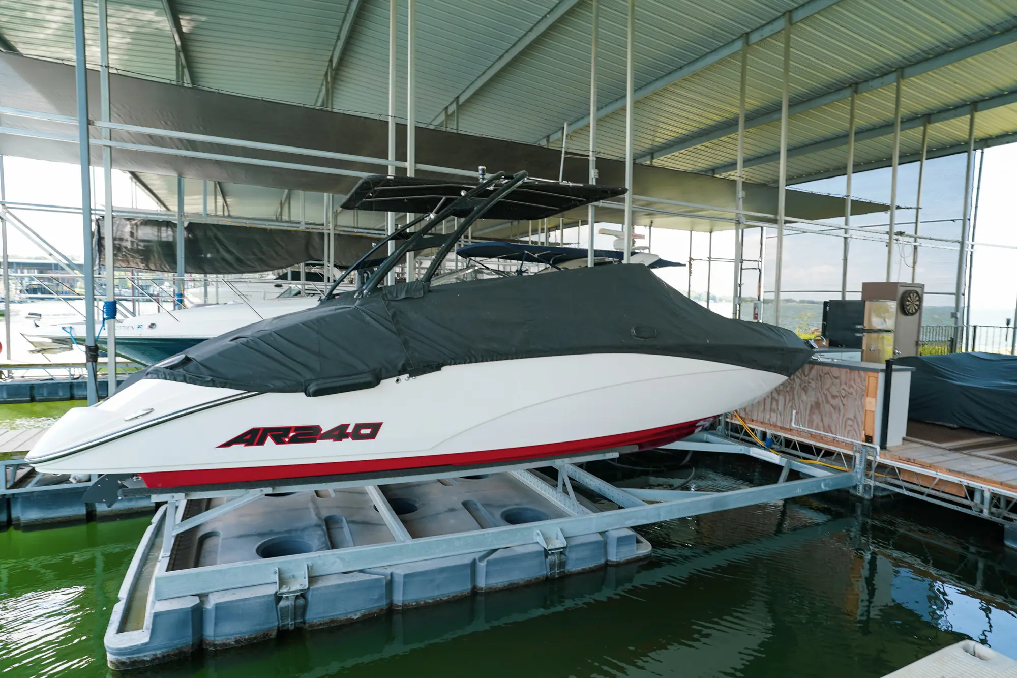 Front Mount UltraLift installed inside a covered floating dock slip