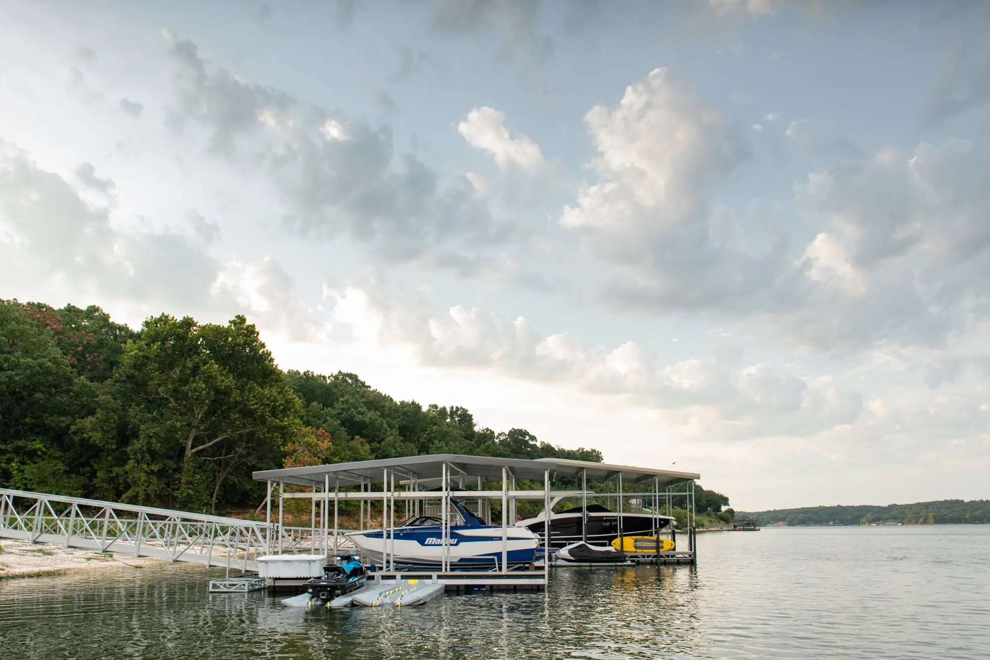 Covered floating dock installation suited for a site-specific HydroHoist review