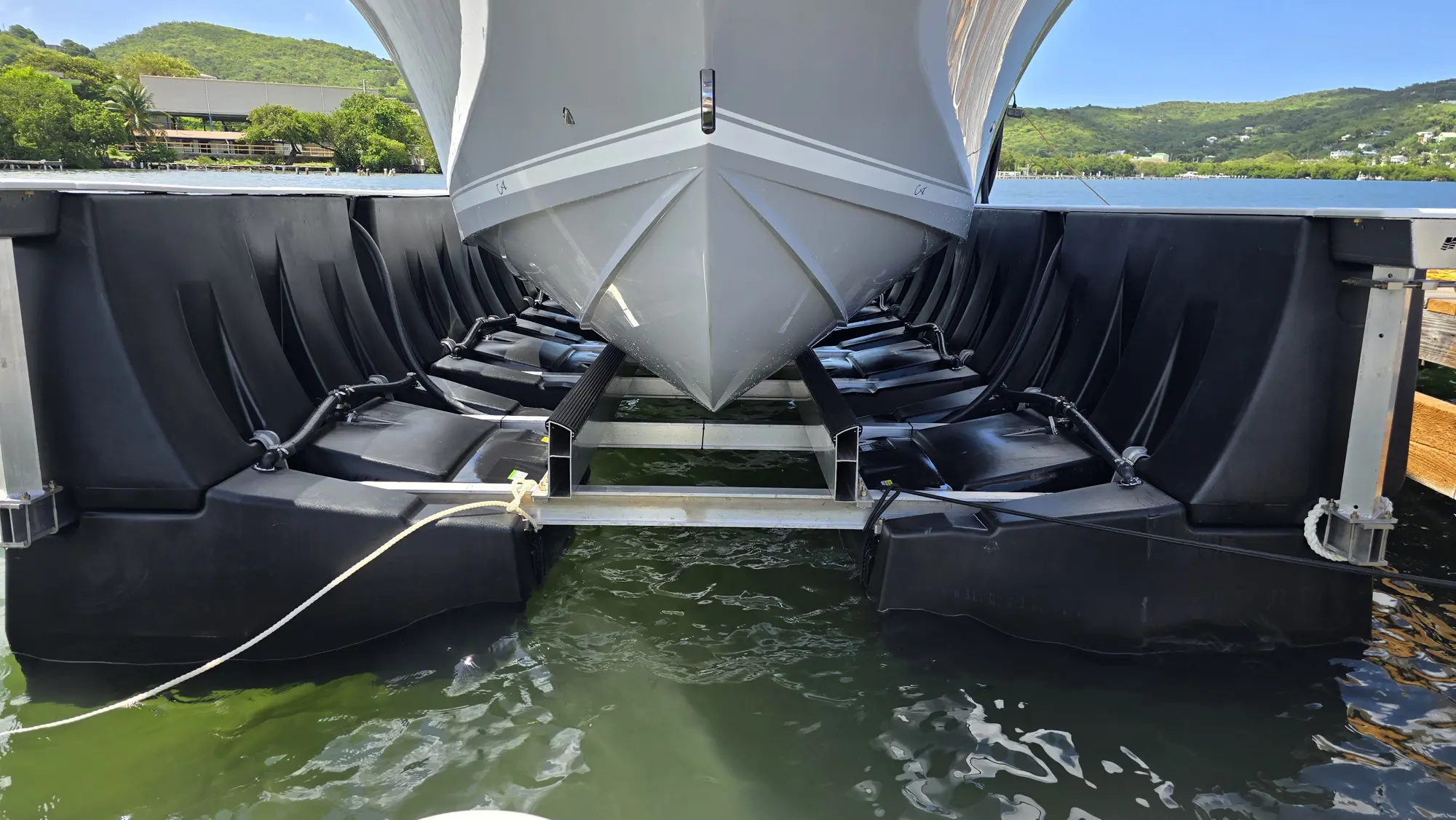 HarborHoist free-floating boat lift installed beside a dock