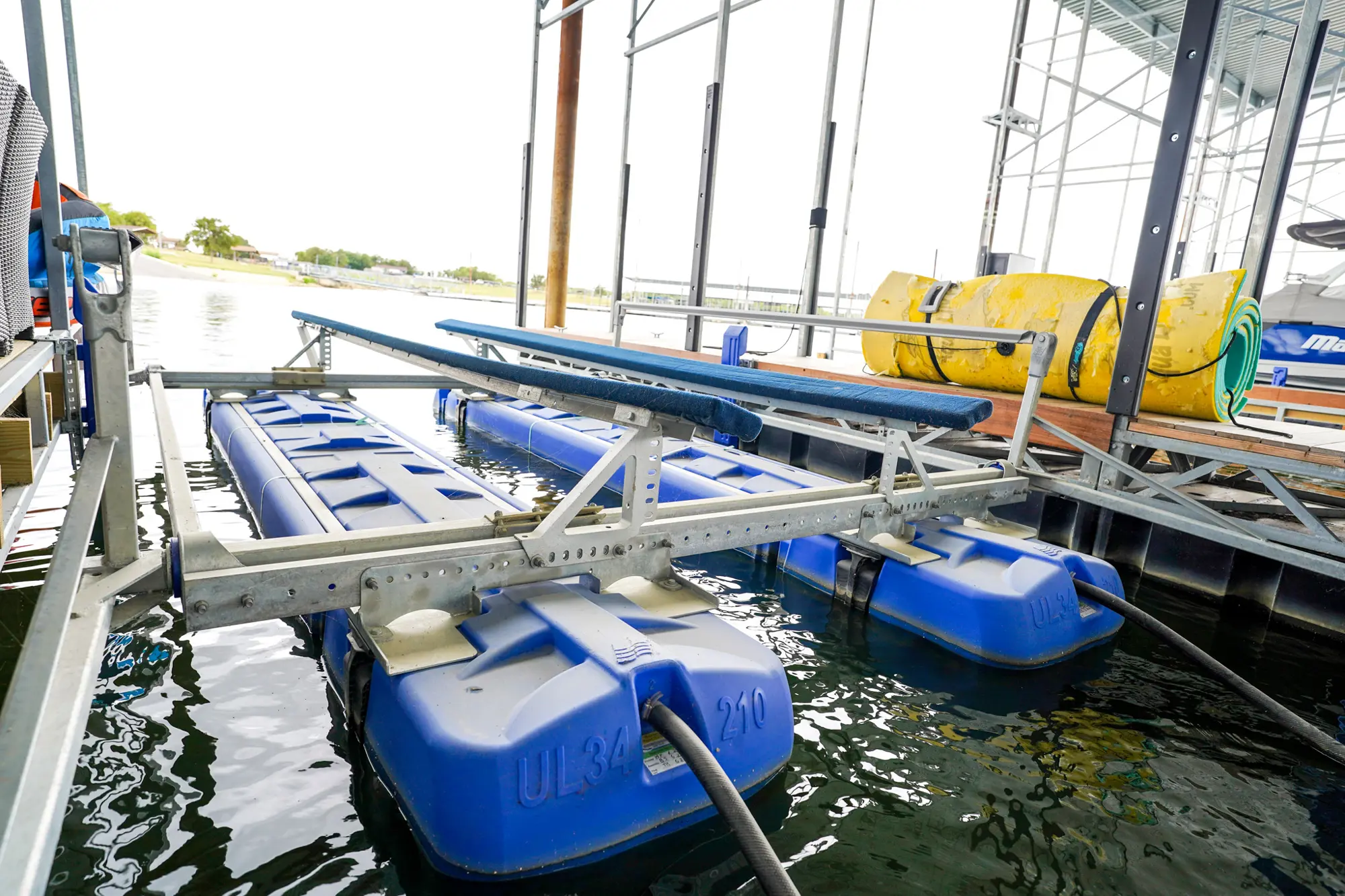 UltraLift freshwater boat lift installed inside a covered boat slip